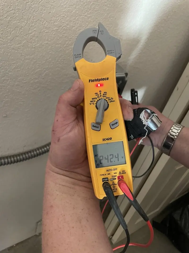 Voltage testing with clamp meter during Aluminum Wiring Replacement in Nassau Bay